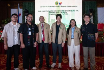 A group of people standing in front of a screen

AI-generated content may be incorrect.