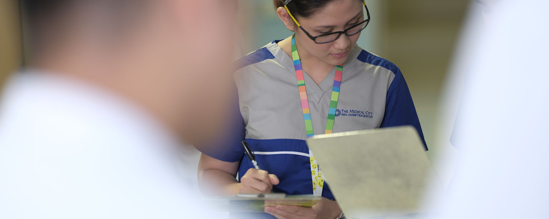 nurse writing down information