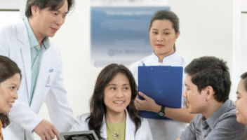 group of doctors and nurses discussing