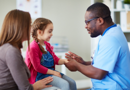 male nurse assisting a female patient