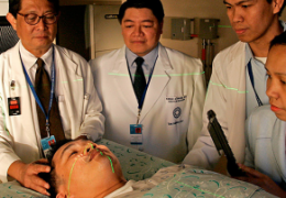 group of doctors analyzing a patient