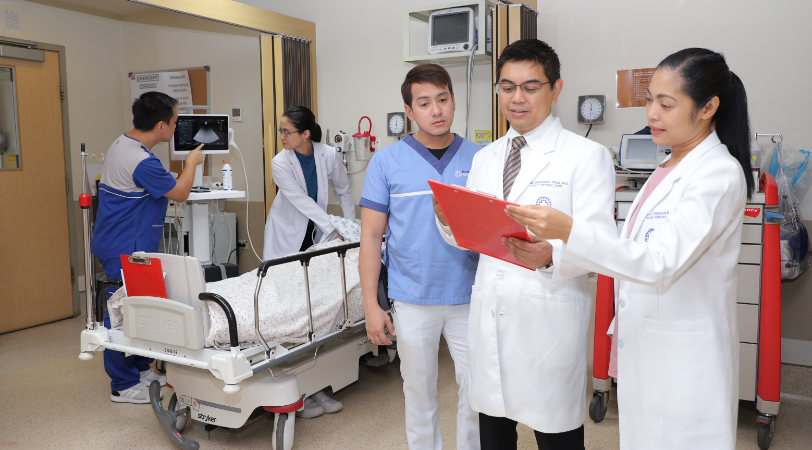 male and female doctor discussing patient test results with male nurse