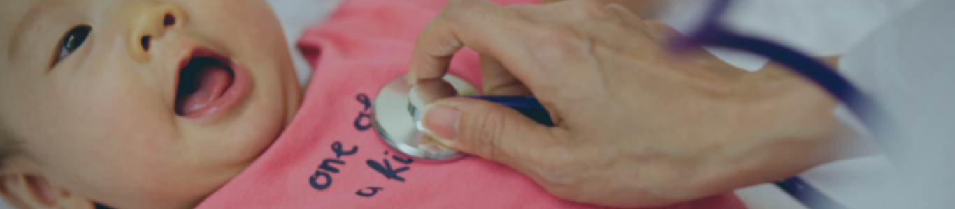 doctor checking a baby's heartbeat