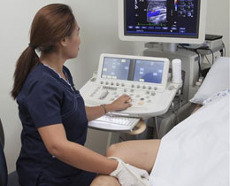 female doctor speaking with an elder female patient