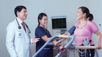 doctor and nurse conducting physical tests on an elder patient