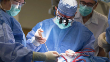 group of surgeons operating on a patient