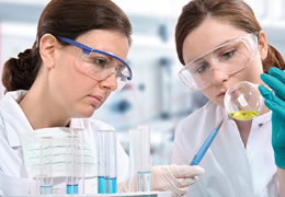 two female doctors analyzing a specimen