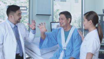 male doctor and female nurse discussing test results to a male patient