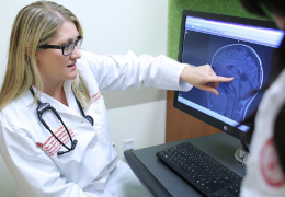 female doctor analyzing an mri scan result